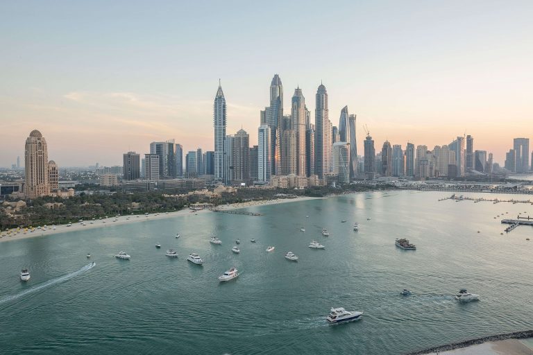 Photo credit: Dubai Marina skyline at dusk with boats on the water — Abid Ali, Pexels.com