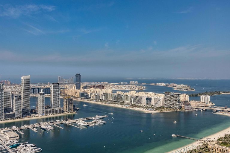 Stunning aerial view of Dubai Marina skyline and Palm Jumeirah on a clear day.