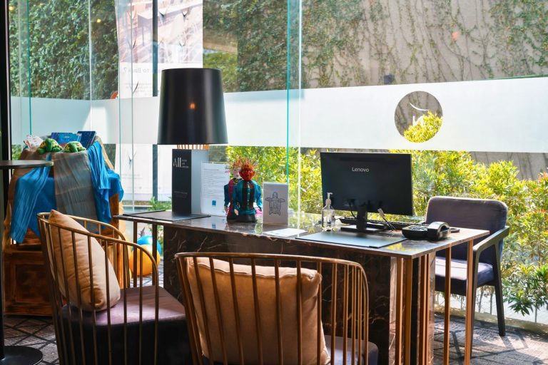 Hotel reception desk with a computer workstation